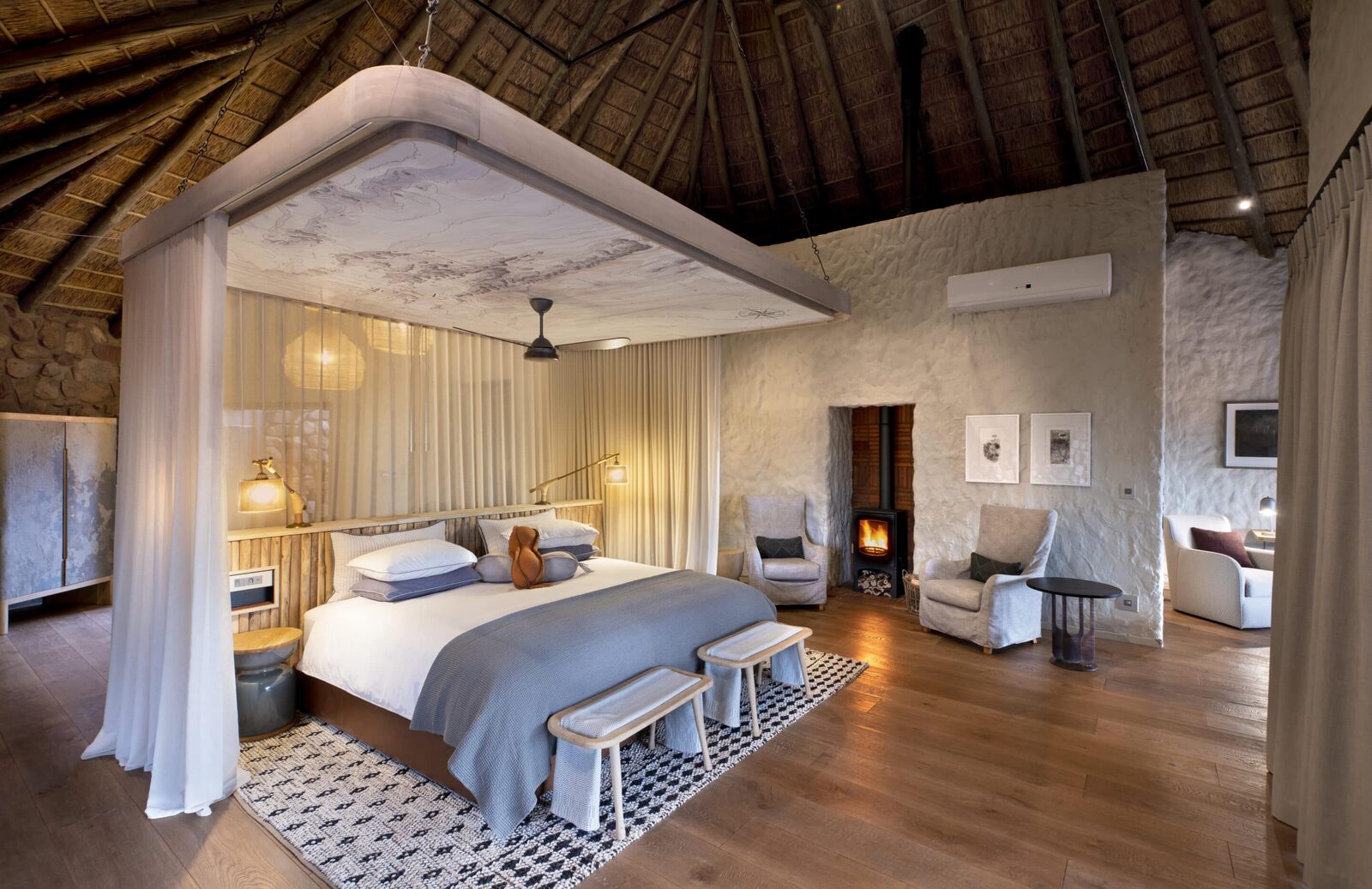 Tswalu Kalahari four-poster honeymoon suite with fireplace