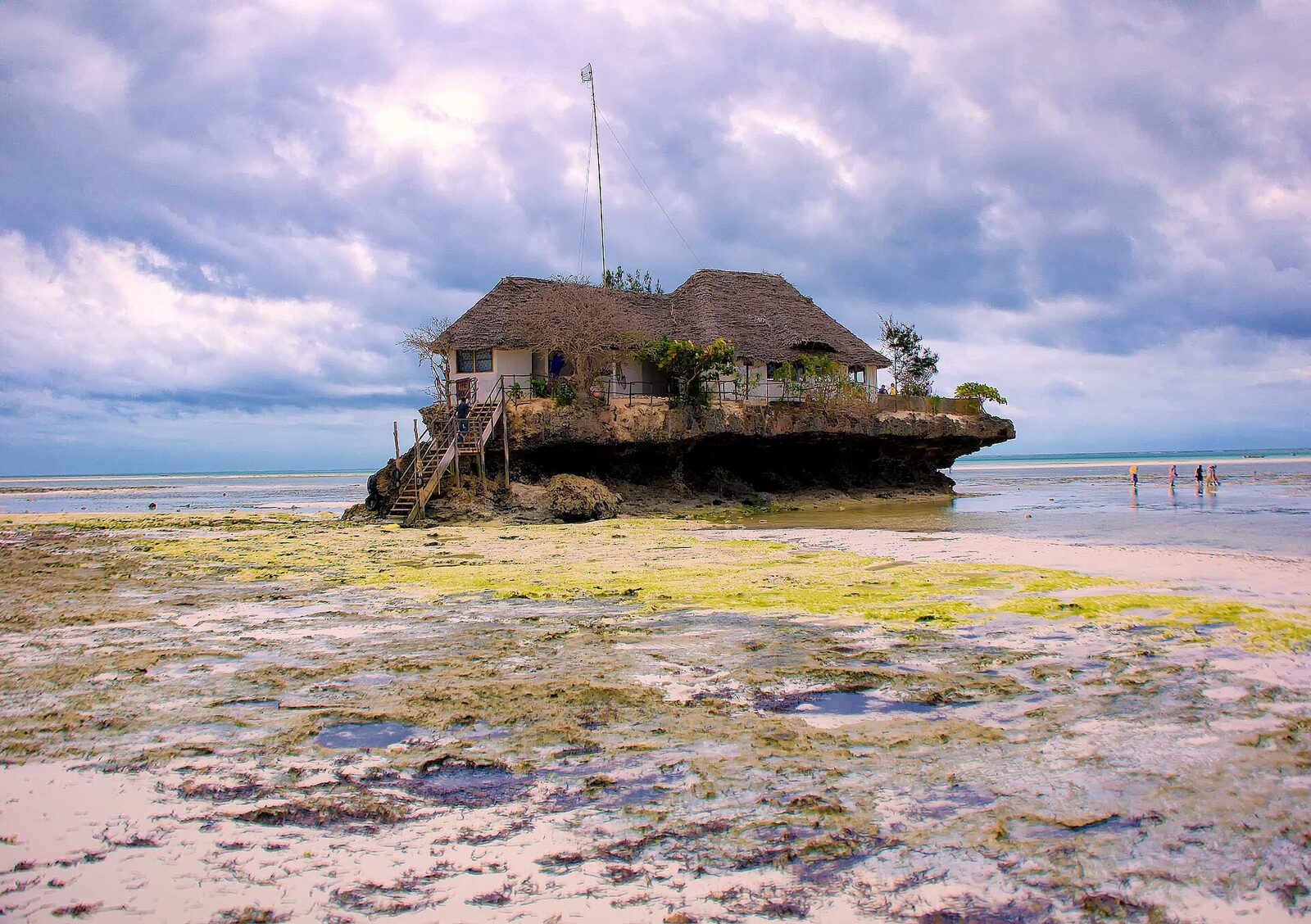 The Rock Restaurant on a coral outcrop with a beach behind, Zanzibar
