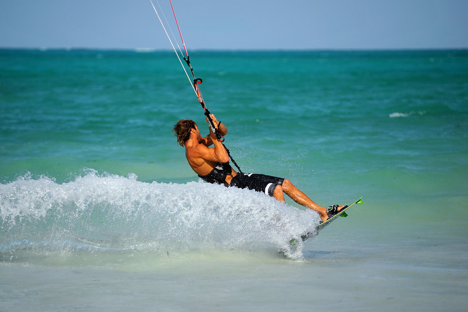 A kitesurfer riding the reef-protected lagoon at Paje on Zanzibar's southeast coast
