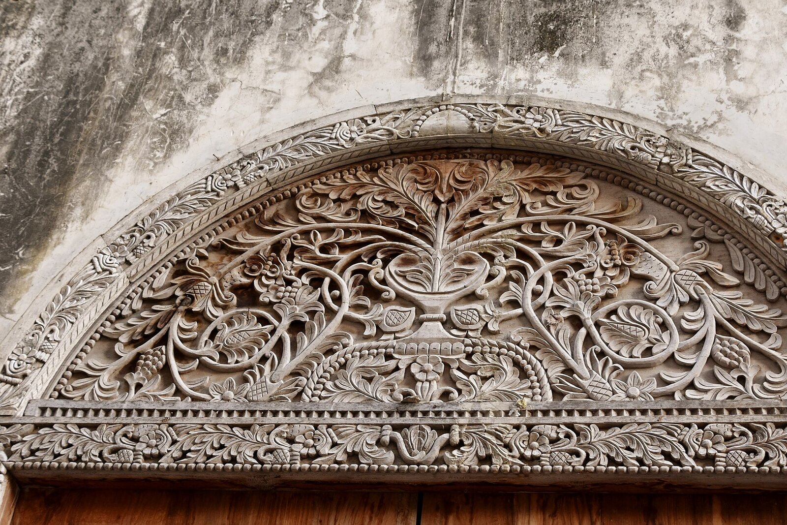 An intricately carved Zanzibari door in Stone Town, blending Arab, Indian and Swahili craftsmanship