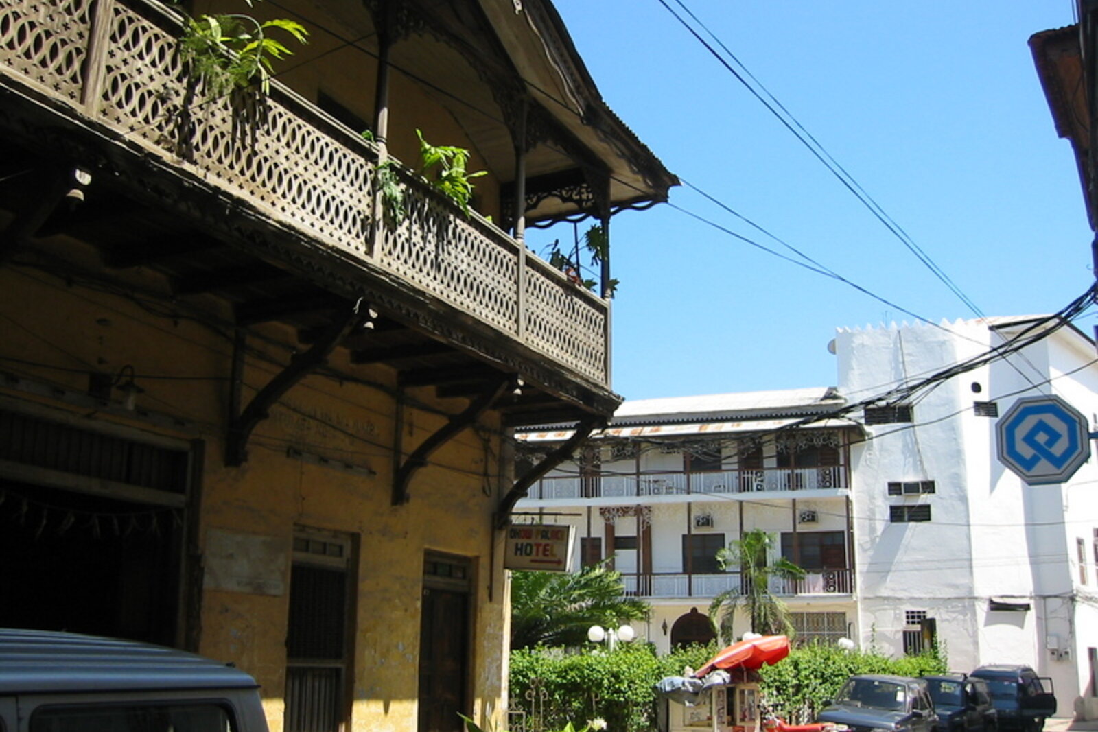 A historic street lined with balconied buildings in Stone Town, Zanzibar
